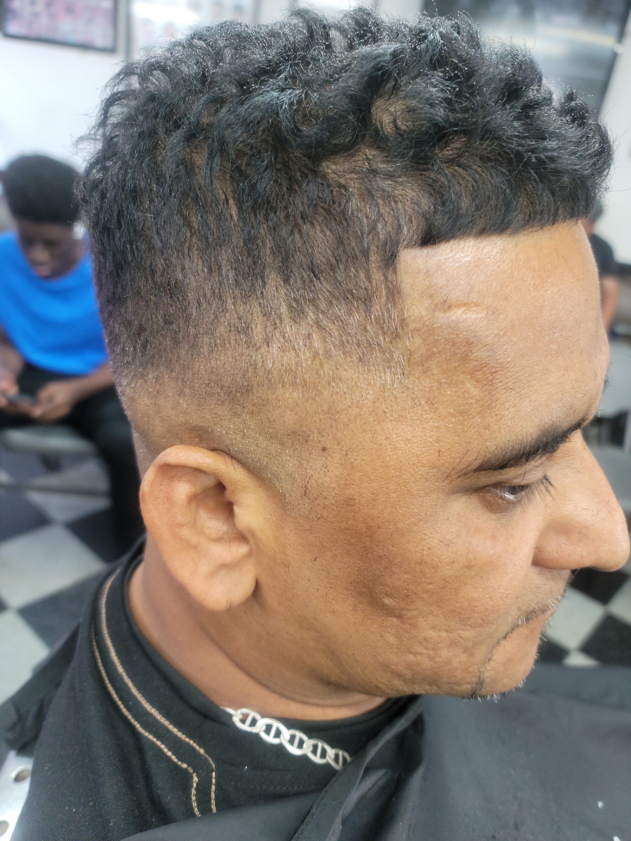 A fresh fade with a sharp hairline