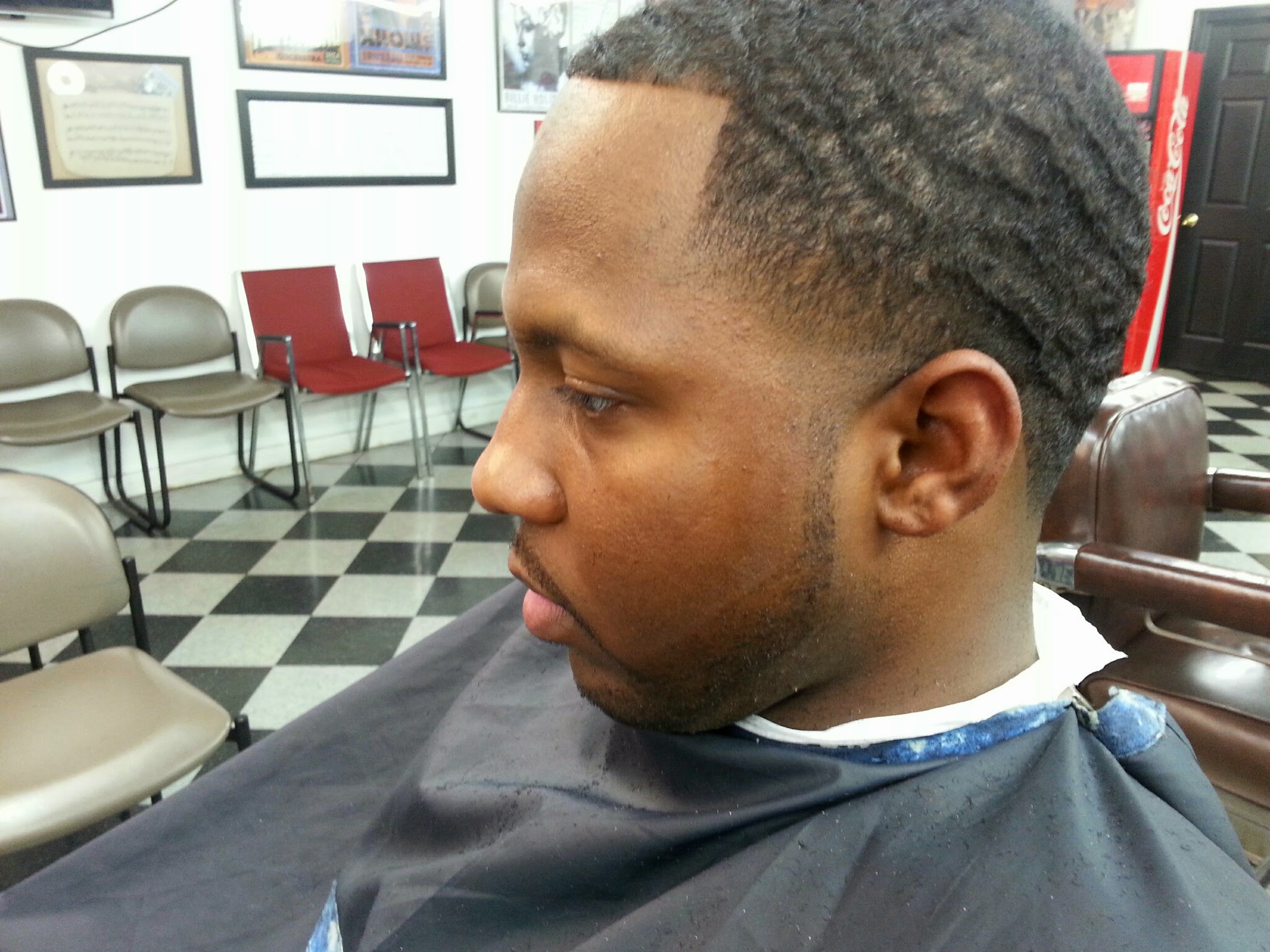 A clean fade in our chair with the waiting area behind
